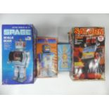 Four Vintage Boxed Robots, including a tinplate battery operated Space Walk Man ME 100, a boxed