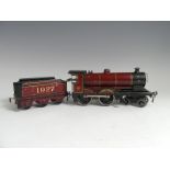 Bassett-Lowke '0' gauge 1927 4-4-0 locomotive and tender, clockwork, red and black lined in yellow.