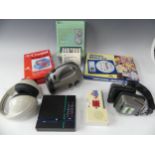 A large collection of Novelty radios, including headphone radios, a crossword radio toilet roll