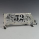 Lawson E. Rudge (b. 1936), a raku fired studio pottery sculpture of an elongated Cow, numbered 52,