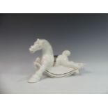 Lawson E. Rudge (b. 1936), a white glazed studio pottery sculpture Carousel Horse, hairline crack to