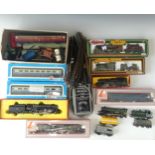 A quantity of OO gauge model railway  boxed examples to include Hornby R550 black livery Loco and