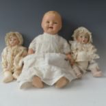 A 1920's composition and cloth Baby Boy doll, cloth body contains crier, sleeping eyes and open