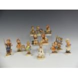 a small quantity of Hummel Figures of Children, depicted engaging in various sporting and