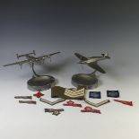 A WW2 period aluminium Spitfire mounted ashtray, the model mounted on a straight arm, leading to a