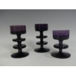 A pair of Wedgwood Sheringham pattern amethyst glass Candle Holders, designed by Ronald Stennett