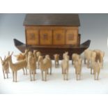 A 1930's/1940's handmade wooden Noah's Ark, with sliding door and catch, together with a large