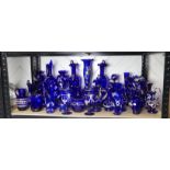 A quantity of late 19thC Bristol blue Glassware, to include gilt and floral decorated Vases,