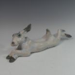 Lawson E. Rudge (b. 1936), a raku fired studio pottery sculpture of a Hare, modelled cross legged, L