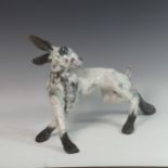 Lawson E. Rudge (b. 1936), a raku fired studio pottery sculpture of a Hare, with blue tinted