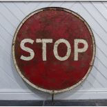 An original vintage 20th century ' Stop / Go ' metal roadside industrial sign, circular form, with