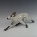 Lawson E. Rudge (b. 1936), a raku fired studio pottery sculpture of a Hare, modelled walking, L