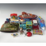 A collection of vintage tinplate toys, to include: a friction driven metalmania space patrol