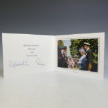 H.M.Queen Elizabeth II and H.R.H.The Duke of Edinburgh, signed 2004 Christmas card with twin gilt