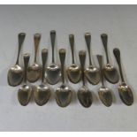 A collection of twelve mid 18thC silver picture back Teaspoons, with scroll and foliate backs,
