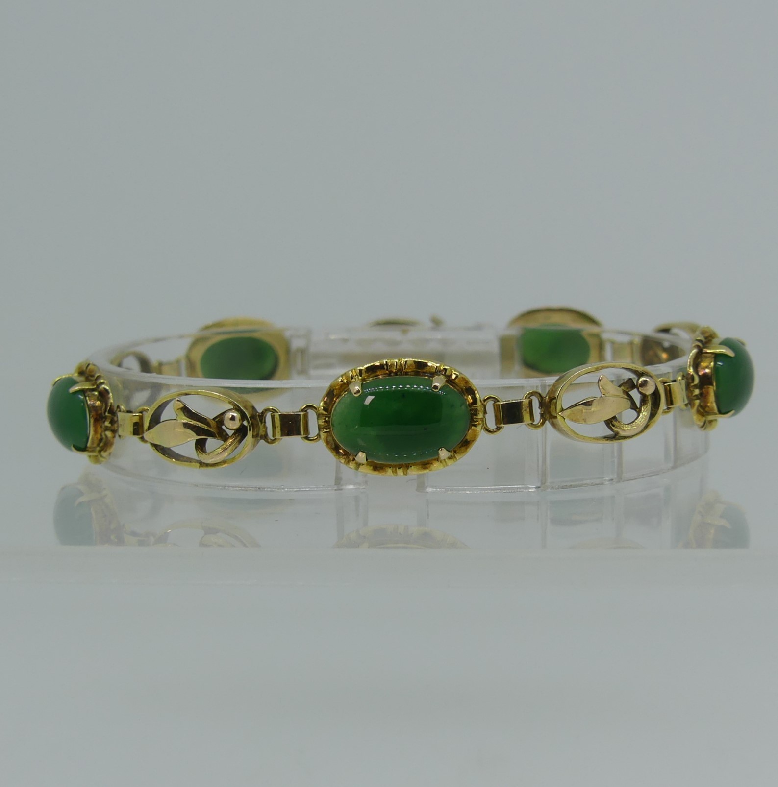 A 14ct yellow gold Bracelet, set with five oval cabochon jades, the integral clasp marked 14k and - Image 3 of 3