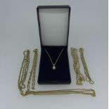An 18ct yellow gold Chain, 57cm long, 7.5g, together with four 9ct gold chains, total weight 22.