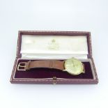 A 9ct gold Eterna for Garrard & Co., gentleman's Wristwatch, the silvered dial with baton markers,