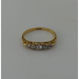 A small graduated five stone diamond Ring, the centre stone 0.13ct, approx total diamond weight 0.