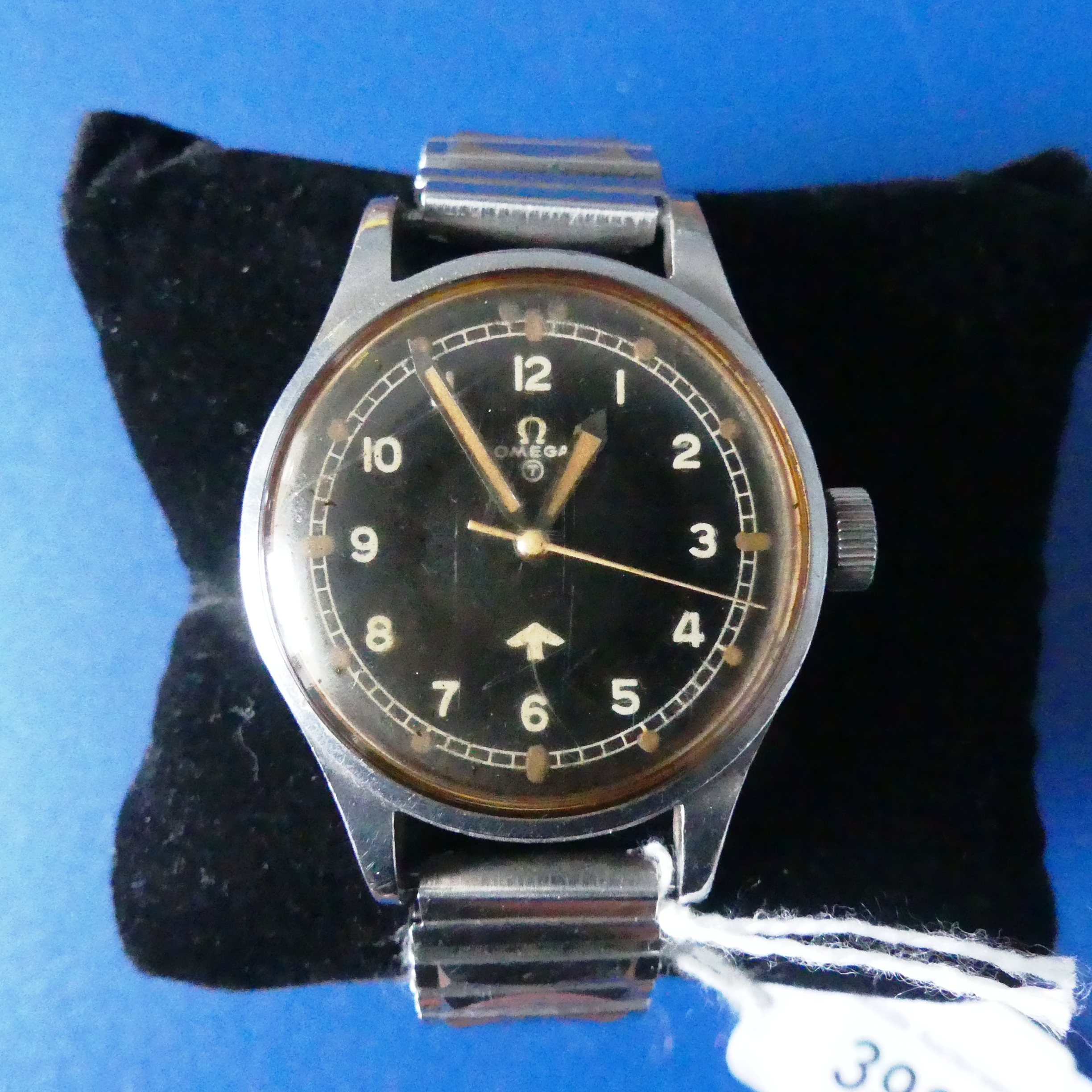 OMEGA, a 1950s military issue stainless steel Wristwatch, the black dial with Military 'fat' broad - Image 3 of 4