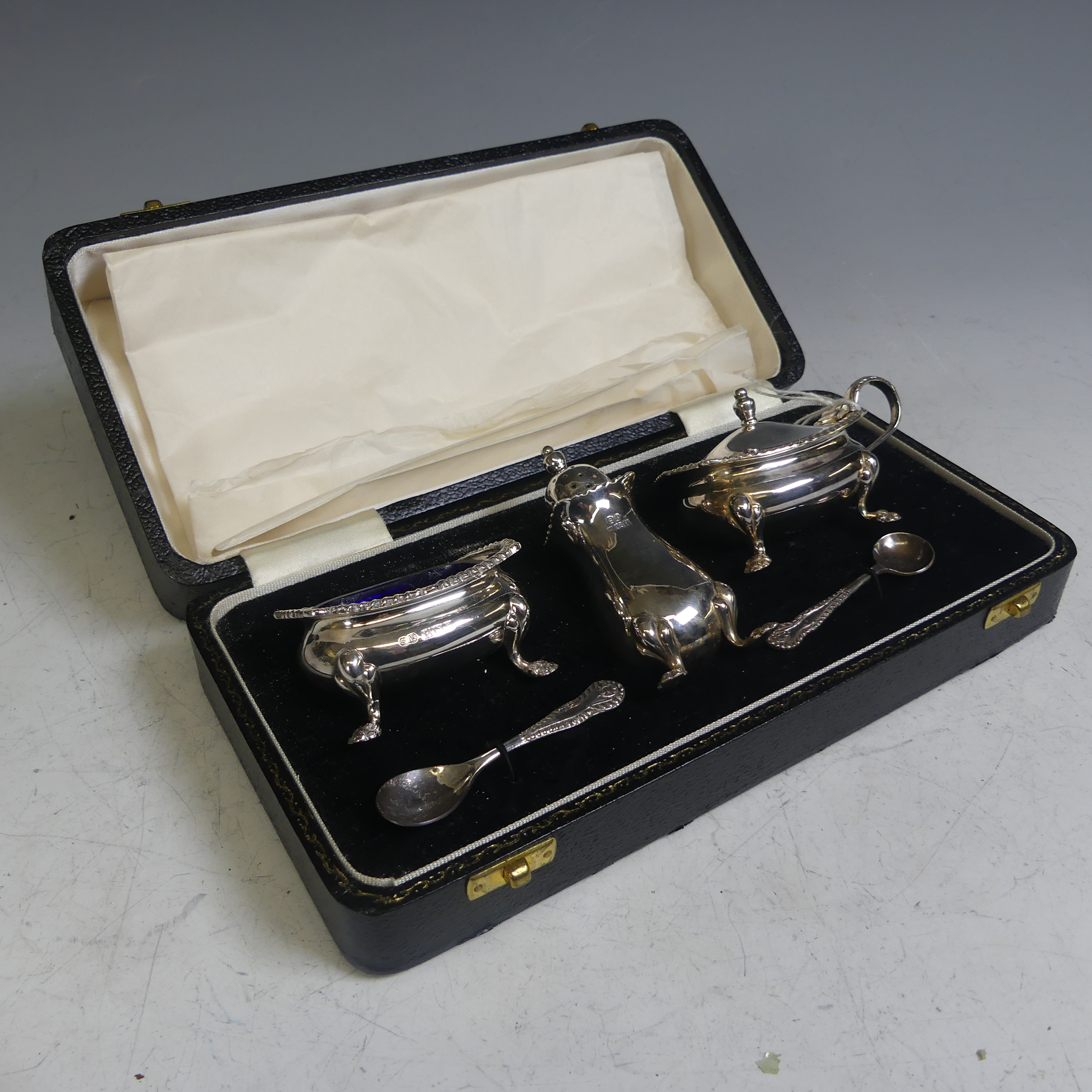 A cased Elizabeth II silver three piece Cruet Set, by William Suckling Ltd., hallmarked Birminghamt)