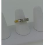 A five stone diamond Ring, the circular cut stones each 0.2ct four claw set in 18ct yellow and white