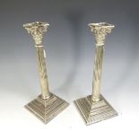 A pair of silver plated column Candlesticks, with removable sconces, 37cm high (2)