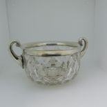 An Edwardian silver mounted cut glass two handled Cooling Bowl, by John Grinsell & Sons,