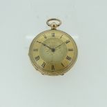 A pretty continental 14k gold open face Pocket Watch, key wound, with foliate engraved decoration