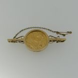 A George V gold Sovereign, dated 1912, in 9ct gold brooch mount, with metal pin, approx total weight