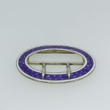 A George V silver and enamel Buckle, by Lawrence Emanuel, hallmarked Birmingham 1910, oval with