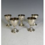 A set of five George III silver Egg Cups, maker's marks worn but probably by Samuel & George