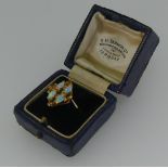 A citrine and opal cluster Ring, with four marquise shaped opals set between a cross of five navette