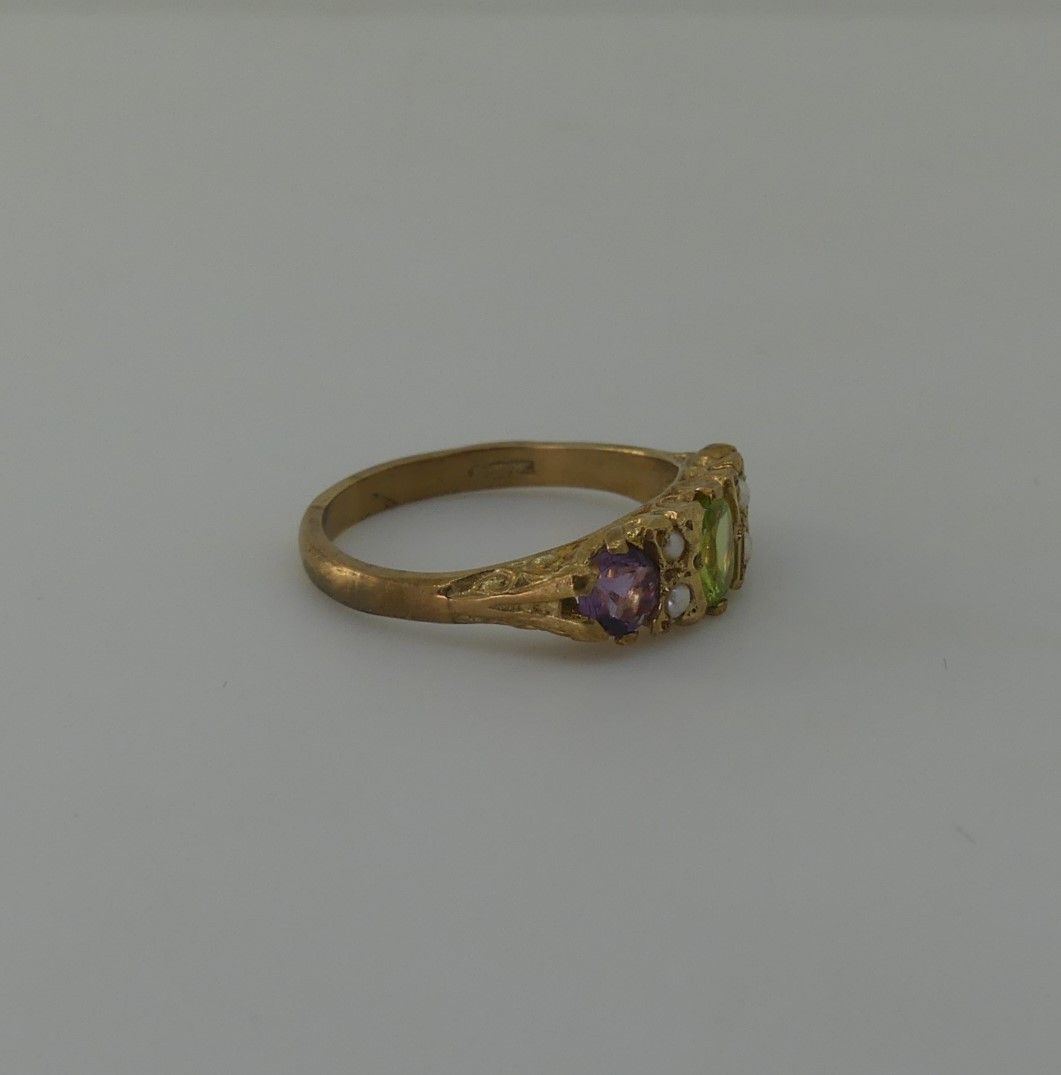 A Suffragette style three stone Ring, the central oval peridot with a circular amethyst on either - Image 2 of 4