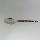 A Norwegian silver and enamel Spoon, by J. Tostrup, the stem and finial with burnt orange enamel and
