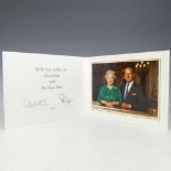 H.M.Queen Elizabeth II and H.R.H.The Duke of Edinburgh, signed 1997 Christmas card with twin gilt
