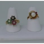 A 14ct yellow gold multi gem set Ring, formed of sapphire, ruby and emerald flowerheads each with