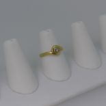 An 18ct gold and diamond Ring, the circular stone approx. 0.17ct collet set in white gold, all
