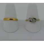 A 22ct yellow gold Wedding Band, Size Q, 2.8g, together with a very small diamond three stone