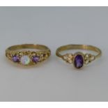 A small 9ct yellow gold and amethyst Ring, the oval stone collect set on open shoulders, Size P½,