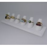 Six 9ct gold Rings; variously set including opal and seed pearl, white paste, amethyst, garnet etc.,