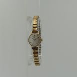 A 9ct gold Omega lady's Wristwatch, on a replacement metal expanding strap.