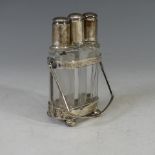 A George V silver three glass Scent Bottle Stand, by Charles S Green & Co Ltd., hallmarked