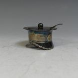A novelty silver plated Mustard Pot, in the form of a miltary officer's cap, with blue glass liner