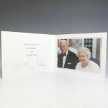 H.M.Queen Elizabeth II and H.R.H.The Duke of Edinburgh, signed 2011 Christmas card with twin gilt