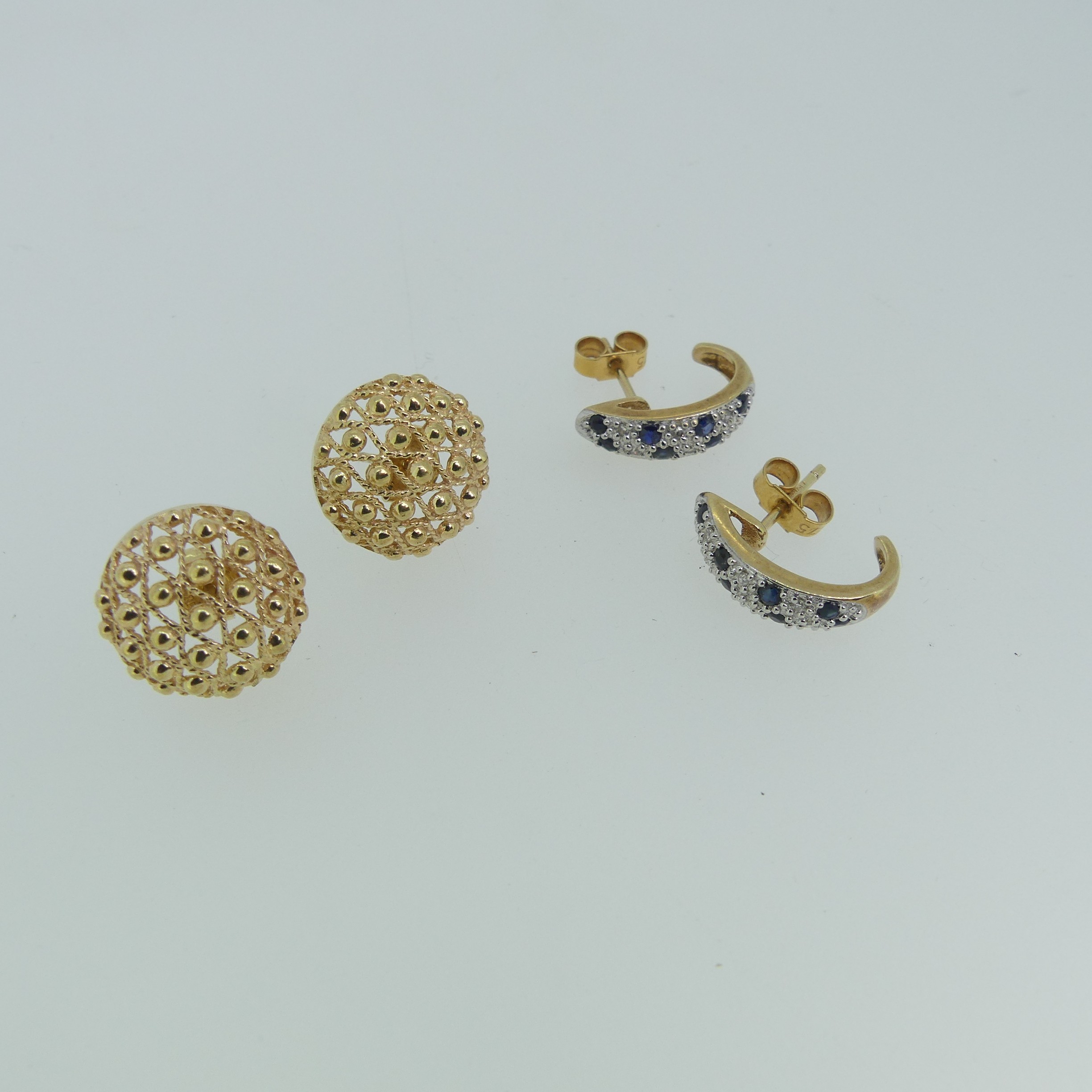 A pair of sapphire and diamond half hoop Earrings, mounted in 9ct yellow gold, marked on the