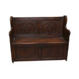 A 19TH CENTURY OAK SETTLE