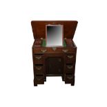 A GEORGE III AND LATER MAHOGANY KNEEHOLE DESK