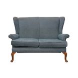 A WINGBACK TWO SEATER SETTEE