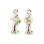 A PAIR OF BOW PORCELAIN PUTTI, 18TH CENTURY